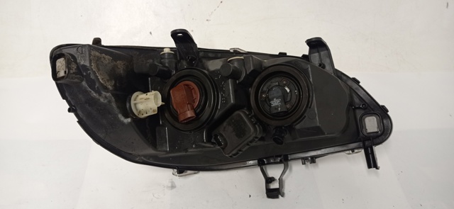 Reflektor lewy 89100054 OPEL