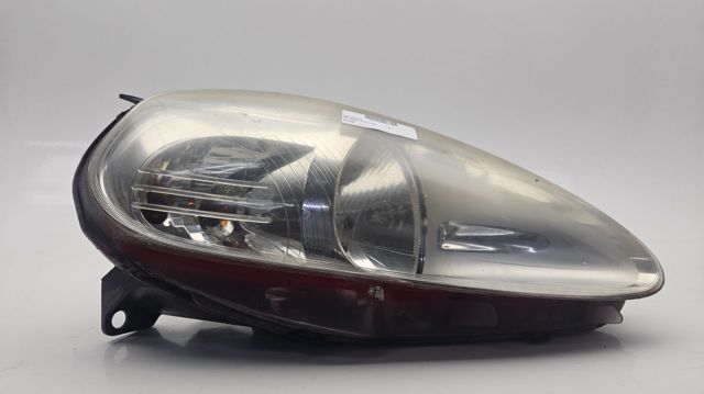 Reflektor prawy 89101388 FIAT