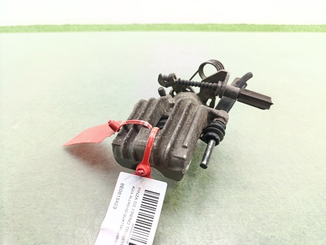 Zacisk hamulcowy tylny lewy 8E0615423 VAG