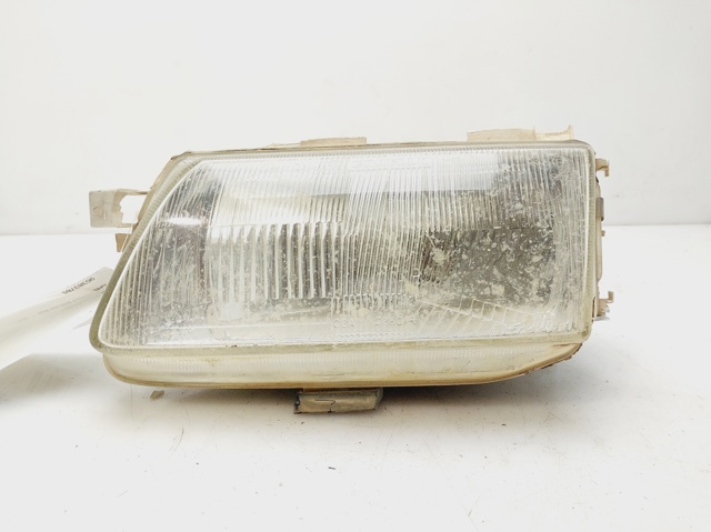 Reflektor lewy 90383786 OPEL