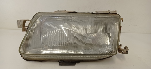 Reflektor lewy 90383786 OPEL