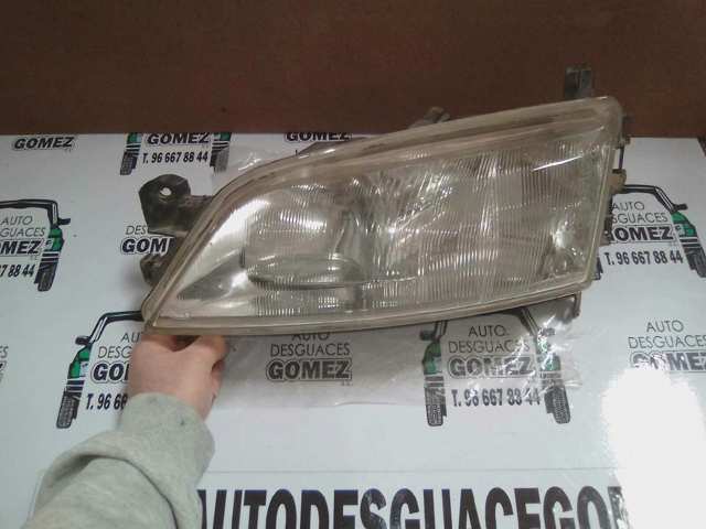 Reflektor lewy 90512318 OPEL
