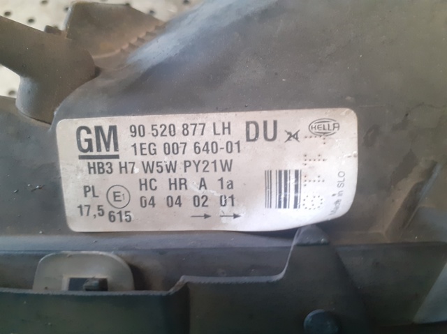 Reflektor lewy 90520877LH OPEL
