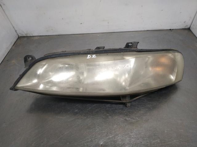 Reflektor lewy 90586844 OPEL