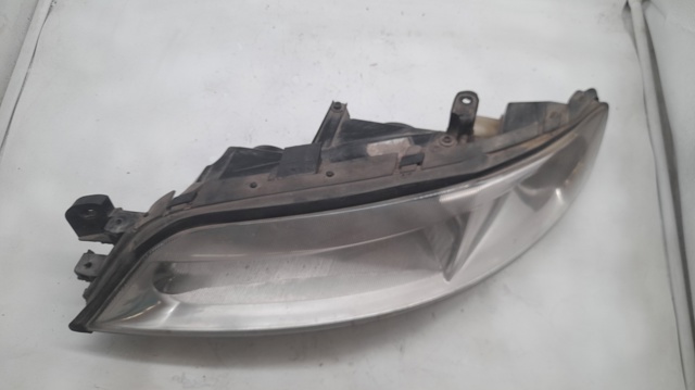 Reflektor lewy 90586844 OPEL
