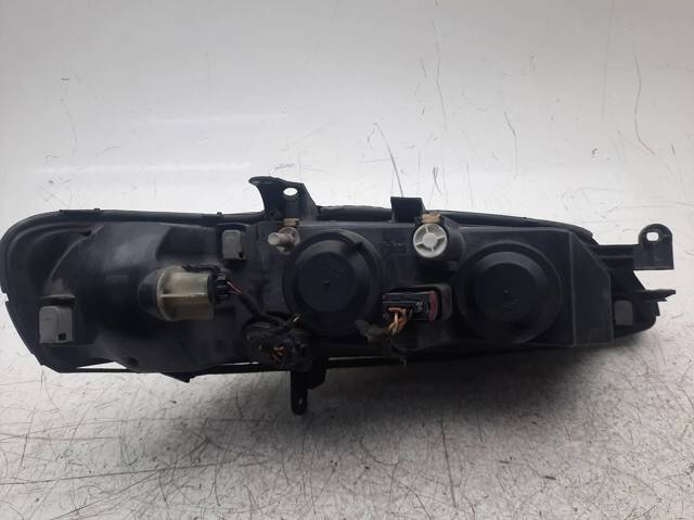 Reflektor lewy 90586844 OPEL