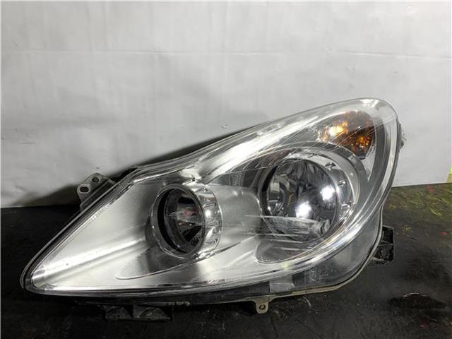 Reflektor lewy 93189357 OPEL