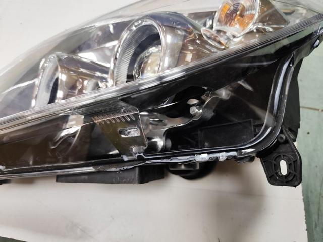 Reflektor lewy 93192377 OPEL