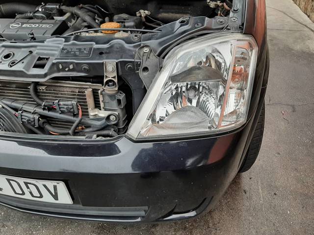 Reflektor lewy 93321052 OPEL