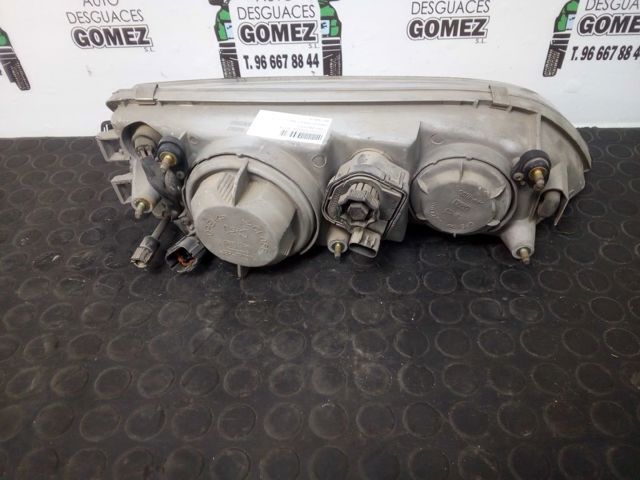 Reflektor lewy Daewoo Espero KLEJ