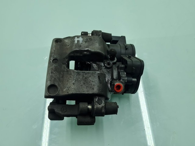 Zacisk hamulcowy tylny lewy A2054231998 MERCEDES