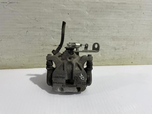 Zacisk hamulcowy tylny prawy B4Y72698ZA MAZDA