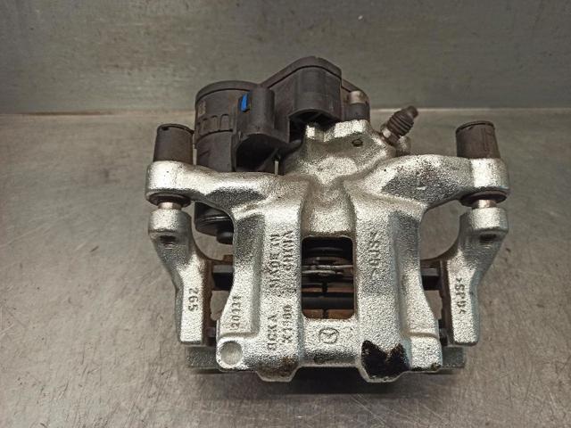 Zacisk hamulcowy tylny lewy B4Y72699ZC MAZDA