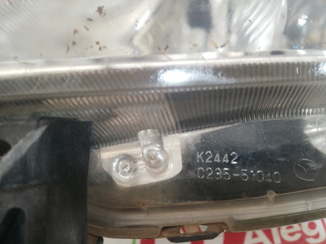 Reflektor lewy C23551040 MAZDA