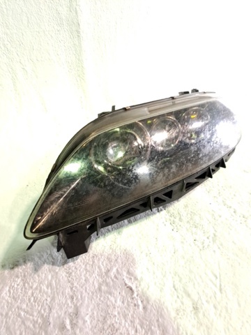 Reflektor lewy GRYA510L0 MAZDA