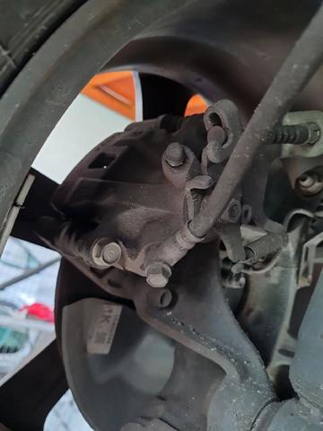Zacisk hamulcowy tylny lewy K0Y12699Z MAZDA