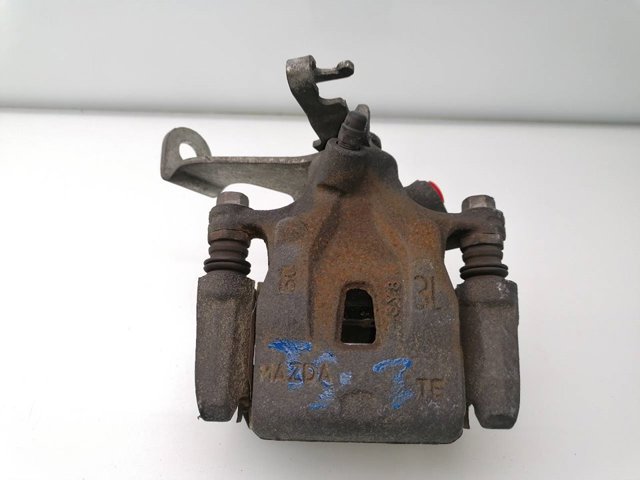 Zacisk hamulcowy tylny lewy K0Y12699ZA MAZDA