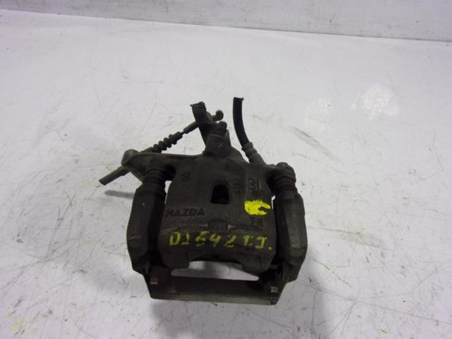 Zacisk hamulcowy tylny lewy K0Y12699ZA MAZDA