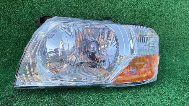 Reflektor lewy MN133751 MITSUBISHI