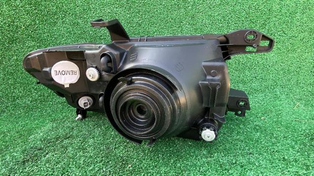 Reflektor lewy MN133751 MITSUBISHI