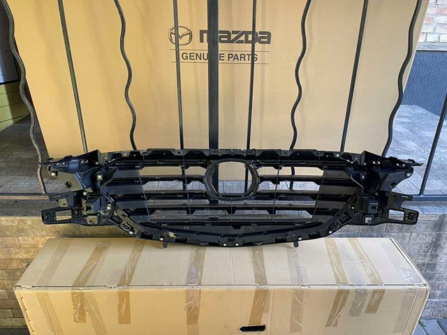 Do koszyka TK4950710J Mazda Atrapa chłodnicy