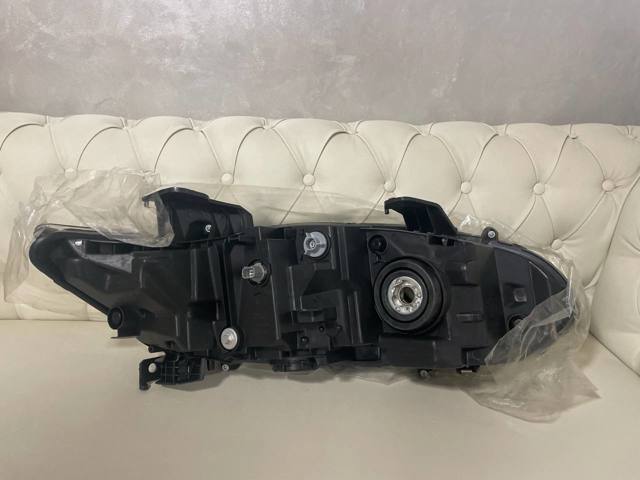 20G256001N TYC Reflektor lewy