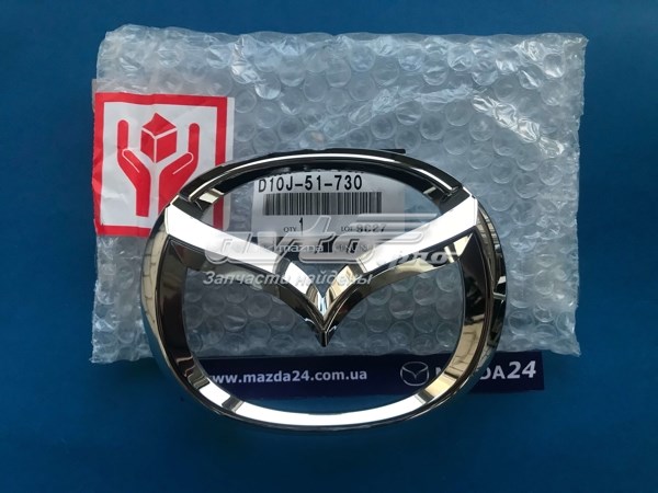 Do koszyka D10J51730 Mazda Emblemat na atrapę chłodnicy