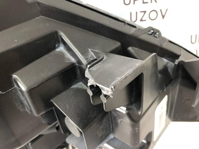 Reflektor lewy 260609UF0C Nissan/Infiniti