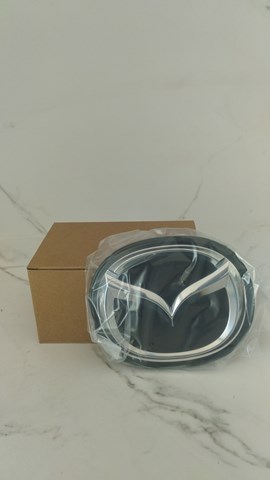 Emblemat na atrapę chłodnicy Mazda BCKB51730A