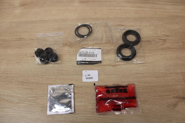 Do koszyka GMY02646ZA Mazda Zestaw naprawczy zacisku hamulcowego tylnego