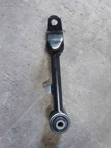 104442300G Tesla Wahacz zawieszenia tylnego górny lewy/prawy