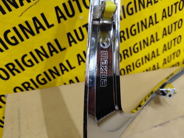 Do koszyka TK5050130A Mazda Listwa ochronna zderzaka przedniego lewa